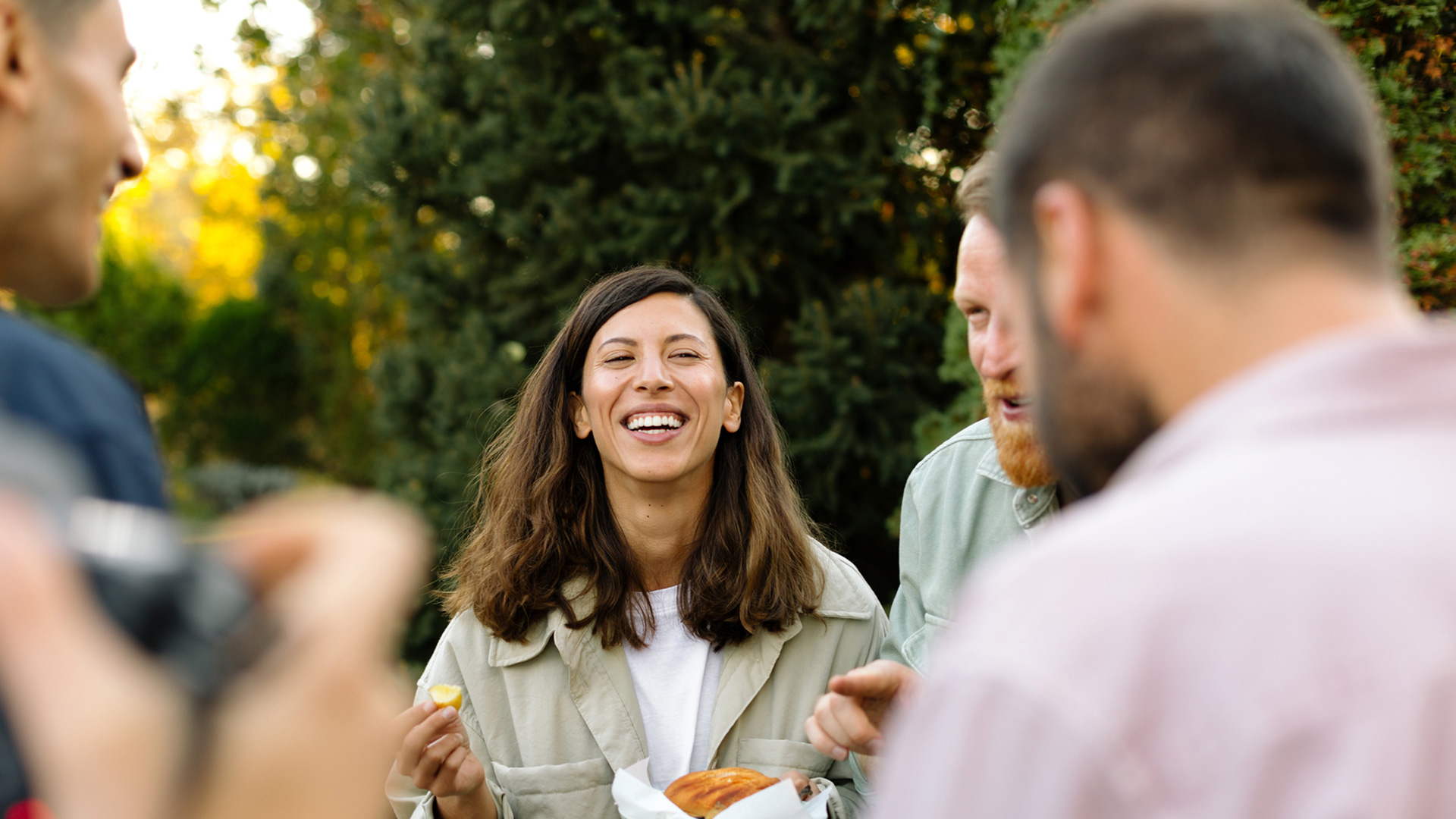 People gathering outside laughing